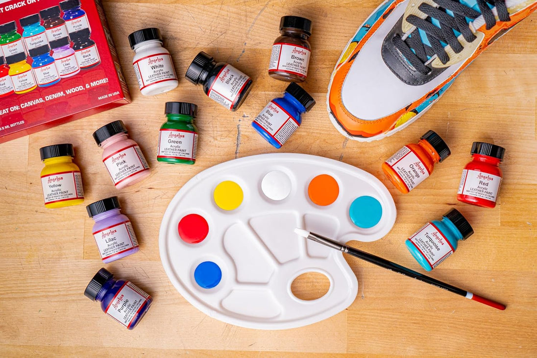 Artist using Angelus Best Sellers paint collection to create custom designs on leather sneakers