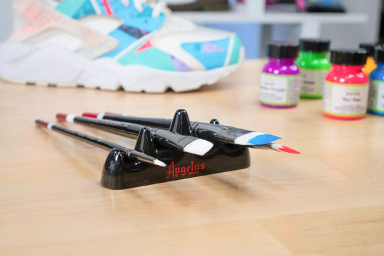 Angelus brush organizer holding multiple detail brushes for sneaker customisation work sessions