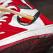 Both Angelus detail bamboo brushes shown with a sneaker illustrating their role in a complete cleaning and maintenance routine