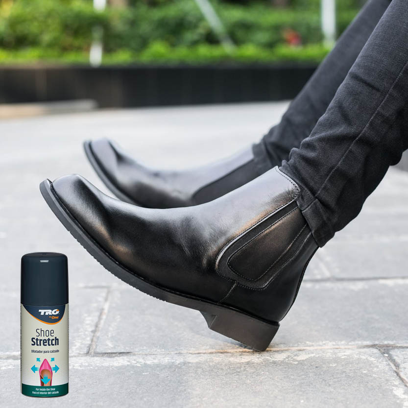 Professional shoe fitting with TRG Stretcher Spray for targeted comfort enhancement on tight areas