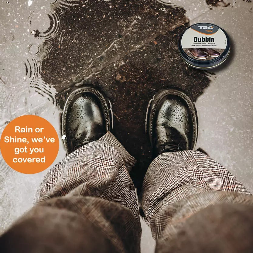 TRG Black Dubbin in use protecting work boots and outdoor footwear from moisture and element damage