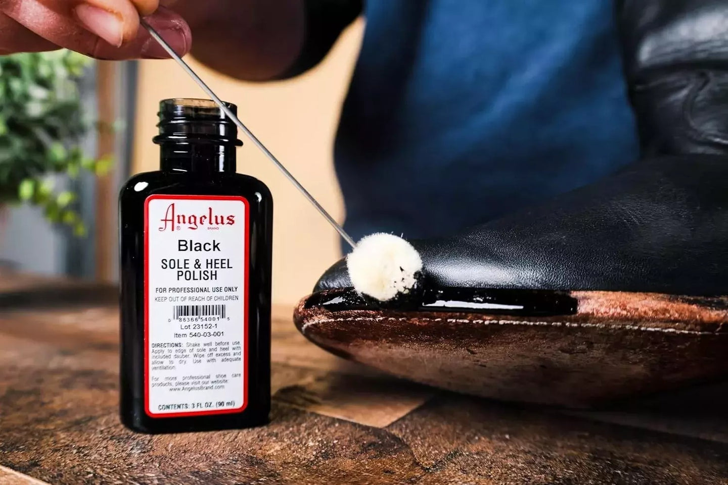 Professional-quality brown edge maintenance with Angelus Sole Polish that complements brown leather footwear